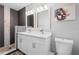 Bathroom featuring double sinks, updated lighting, and a walk-in shower at 3251 Wickersham Ct, Orlando, FL 32806