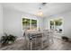 Cozy dining room featuring a bright chandelier and a checkered tablecloth at 3251 Wickersham Ct, Orlando, FL 32806