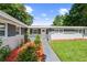 Charming home featuring gray brick accents, a well-manicured lawn, and tasteful landscaping at 3251 Wickersham Ct, Orlando, FL 32806