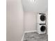 Convenient laundry room with stacked washer and dryer units at 3251 Wickersham Ct, Orlando, FL 32806
