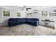 Spacious living room featuring a comfortable sectional sofa, wood floors and natural lighting at 3251 Wickersham Ct, Orlando, FL 32806