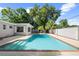 Beautiful backyard pool with blue water and inviting steps, enclosed by a well-maintained concrete patio at 3251 Wickersham Ct, Orlando, FL 32806