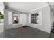 Covered porch with painted cement floor, white door, and open shuttered window at 3251 Wickersham Ct, Orlando, FL 32806