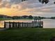 Idyllic lakeside gazebo at sunset, offering a peaceful retreat within the community at 342 Lakebreeze Cir, Lake Mary, FL 32746