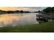Beautiful lake view featuring a wooden gazebo and serene waterscape at 342 Lakebreeze Cir, Lake Mary, FL 32746