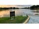 Picturesque community lake with a pier, along with rules and regulations posted at 342 Lakebreeze Cir, Lake Mary, FL 32746