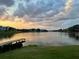 Stunning sunset view over the lake showcasing the waterfront community and pier at 342 Lakebreeze Cir, Lake Mary, FL 32746