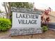 Lakeview Village community sign featuring stone accents and manicured landscaping at 342 Lakebreeze Cir, Lake Mary, FL 32746