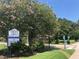 Entrance to the Cross Seminole Trail, enhanced by blooming trees and lush greenery at 342 Lakebreeze Cir, Lake Mary, FL 32746