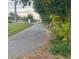 Picturesque paved community walking trail surrounded by lush greenery and natural beauty at 342 Lakebreeze Cir, Lake Mary, FL 32746