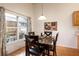 Cozy dining area with views to the outside, and stylish wooden table and chairs at 342 Lakebreeze Cir, Lake Mary, FL 32746