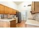 Efficient kitchen featuring modern appliances, ample counter space, and convenient laundry area at 342 Lakebreeze Cir, Lake Mary, FL 32746
