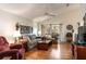 Inviting living room with hardwood floors, vaulted ceiling, and ample natural light at 342 Lakebreeze Cir, Lake Mary, FL 32746