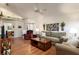 Spacious living room features hardwood floors, vaulted ceiling, and comfortable seating arrangement at 342 Lakebreeze Cir, Lake Mary, FL 32746
