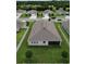 Spacious backyard with screened patio, and well-manicured landscaping and lawn at 444 Halter Dr, Apopka, FL 32712