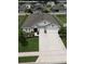 A beautiful aerial view of a home featuring a well-manicured lawn at 444 Halter Dr, Apopka, FL 32712