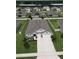Perfectly aligned single-Gathering home shows nice landscaping and lawn at 444 Halter Dr, Apopka, FL 32712