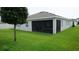 The backyard has a screened-in porch which allows for enjoying the outdoors at 444 Halter Dr, Apopka, FL 32712