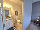 This bathroom includes a granite vanity and a glass shower stall at 444 Halter Dr, Apopka, FL 32712