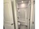 Small bathroom with white tile surround and neutral finishes at 444 Halter Dr, Apopka, FL 32712