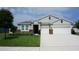 Beautiful single-Gathering home with a well-maintained lawn and a two-car garage at 444 Halter Dr, Apopka, FL 32712