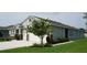 Well-manicured lawn and landscaping highlight the beauty of this home's exterior at 444 Halter Dr, Apopka, FL 32712