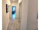 Hallway features neutral walls and tiled flooring, leading to various rooms of the house at 444 Halter Dr, Apopka, FL 32712