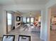 Bright living room with a fireplace, modern decor, tile floors, and a large sectional sofa at 444 Halter Dr, Apopka, FL 32712