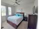 Relaxing main bedroom with neutral walls, ceiling fan, and two windows at 444 Halter Dr, Apopka, FL 32712