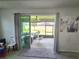 View from the living room to the patio with ceiling fan and furniture at 444 Halter Dr, Apopka, FL 32712