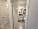 A well-lit powder room with stylish vanity and toilet featuring tiled floors in a neutral palette at 444 Halter Dr, Apopka, FL 32712