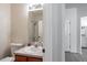Bathroom featuring a vanity with sink, toilet, and a shower with glass doors at 4833 Cypress Woods Dr # 4205, Orlando, FL 32811