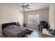 Comfortable bedroom with wood-look tile flooring, and ceiling fan at 4833 Cypress Woods Dr # 4205, Orlando, FL 32811