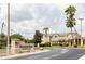SummerGate Condominiums entrance sign with palm trees and well-maintained landscaping at 4833 Cypress Woods Dr # 4205, Orlando, FL 32811