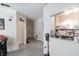 Open floor plan hallway that shows the entrance and kitchen at 4833 Cypress Woods Dr # 4205, Orlando, FL 32811