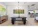 Bright dining room area features a modern chandelier and a stylish dark wood dining set at 489 Grape Ave, St Cloud, FL 34769
