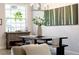 Well-lit dining area features a modern chandelier, unique decor and a decorative wood hutch at 489 Grape Ave, St Cloud, FL 34769