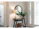 Inviting foyer with stylish decor, providing a warm welcome with a decorative table and a mirror at 489 Grape Ave, St Cloud, FL 34769