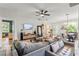 Cozy living room with modern decor, plush seating, and plenty of natural light for comfortable living at 489 Grape Ave, St Cloud, FL 34769