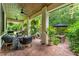 Inviting covered patio featuring comfortable seating and lush landscaping at 489 Grape Ave, St Cloud, FL 34769