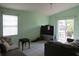 Relaxing living room with tile floors, slider to the patio, and a window at 5224 Florida Holly Dr, Orlando, FL 32811