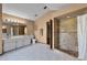 Bright bathroom featuring tiled floor, double vanity, shower with stonework, and private toilet at 526 Sabal Trail Cir, Longwood, FL 32779