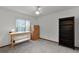 Bright, carpeted bedroom with large window, desk, and bookshelf at 526 Sabal Trail Cir, Longwood, FL 32779