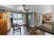 Open concept dining area with sliding doors to the patio, wood table set, ceiling fan, and pool view at 526 Sabal Trail Cir, Longwood, FL 32779