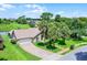 A well-maintained single-Gathering home featuring a brick driveway and mature palm trees at 526 Sabal Trail Cir, Longwood, FL 32779