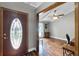 Inviting foyer featuring hardwood floors, an ornate front door and an open view into a living space at 526 Sabal Trail Cir, Longwood, FL 32779
