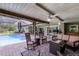Covered patio with comfortable seating and a view of the pool at 526 Sabal Trail Cir, Longwood, FL 32779
