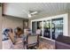 Covered patio with outdoor seating, ceiling fan, and access to the outdoor grill at 526 Sabal Trail Cir, Longwood, FL 32779
