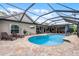 Screened pool with brick patio, lounge chairs, and view of the home's exterior at 526 Sabal Trail Cir, Longwood, FL 32779