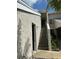 Close-up exterior view showcasing stairway to upper-level residences and textured facade at 5395 Vineland Rd # S, Orlando, FL 32811